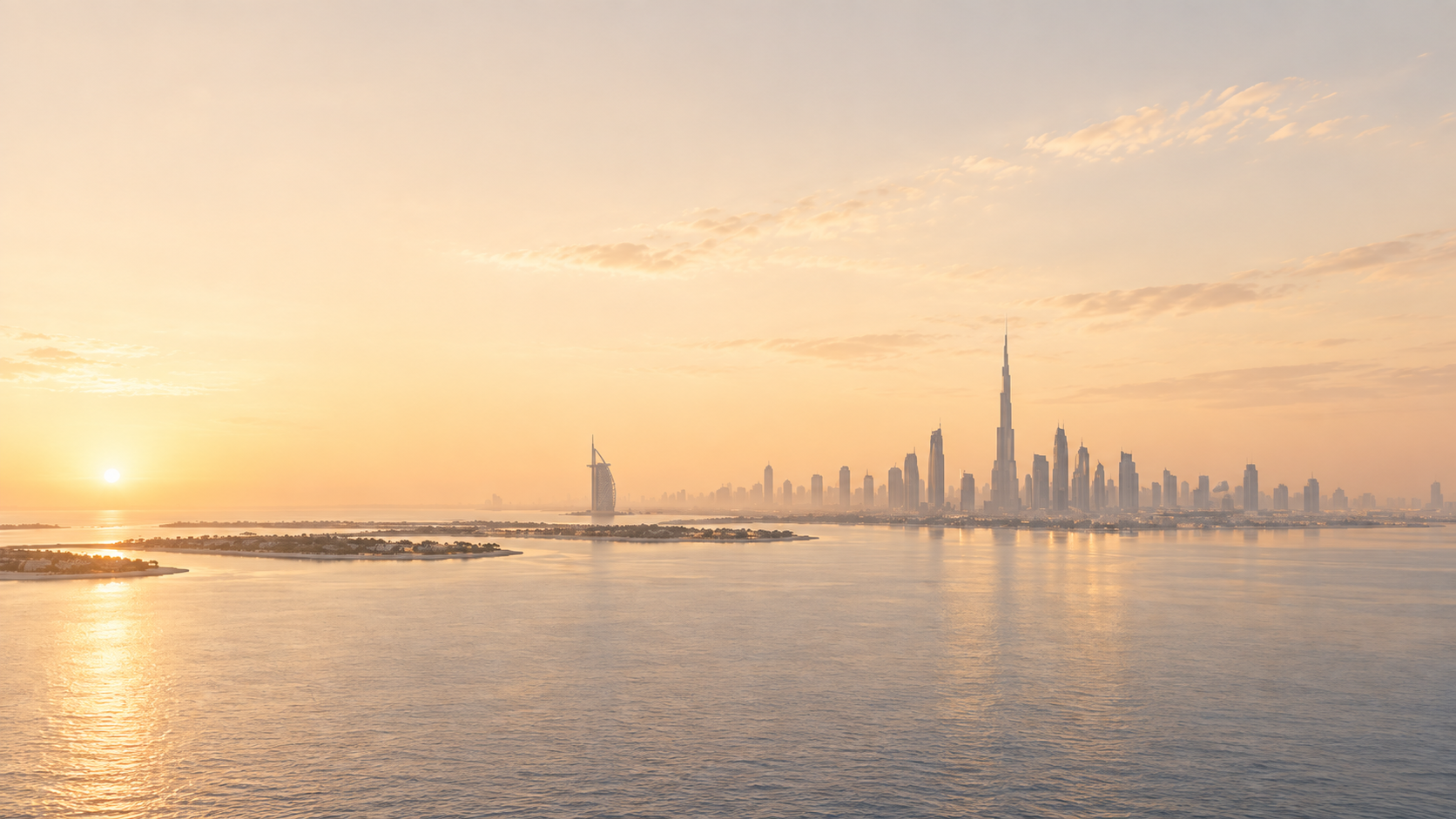 Dubai skyline across the water at sunset